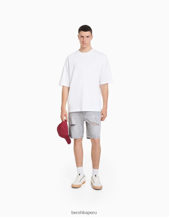 gris oscuro Bershka hombres bermudas de mezclilla con rotos 806J6B3343